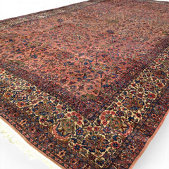 Early 20th Century Kerman Lavar Persian Rug, Hand-Knotted in Iran. Rose Field w/ Ivory Border Accented in Blue and Green. Fine Wool Pile on Cotton Foundation. Classic Overscale Room Size. Measures 11.06Lx19.01W. Circa 1920s.